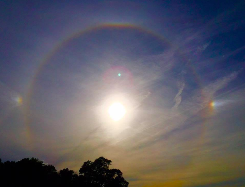Sun with clouds around it.